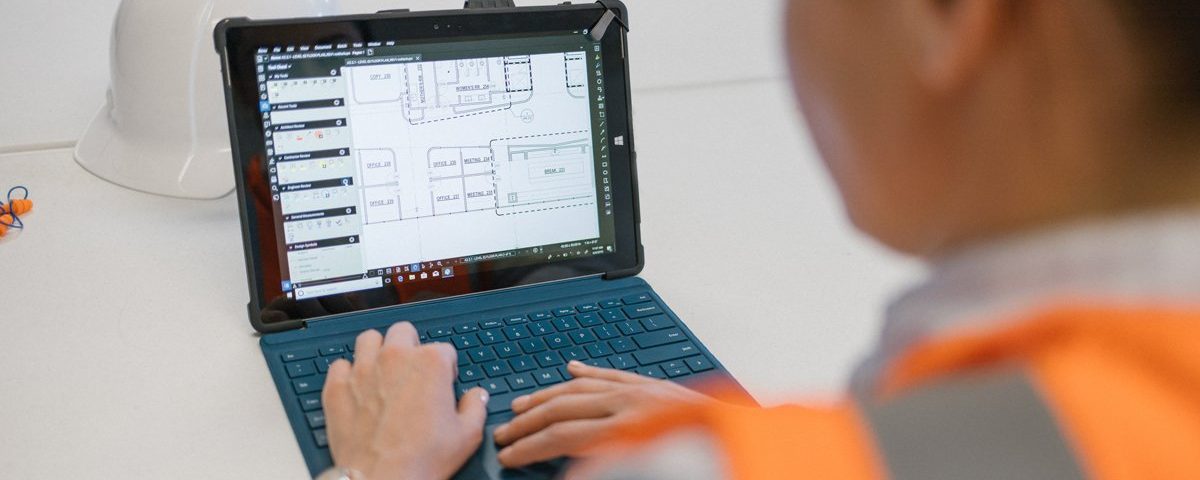 Construction worker using Bluebeam Revu