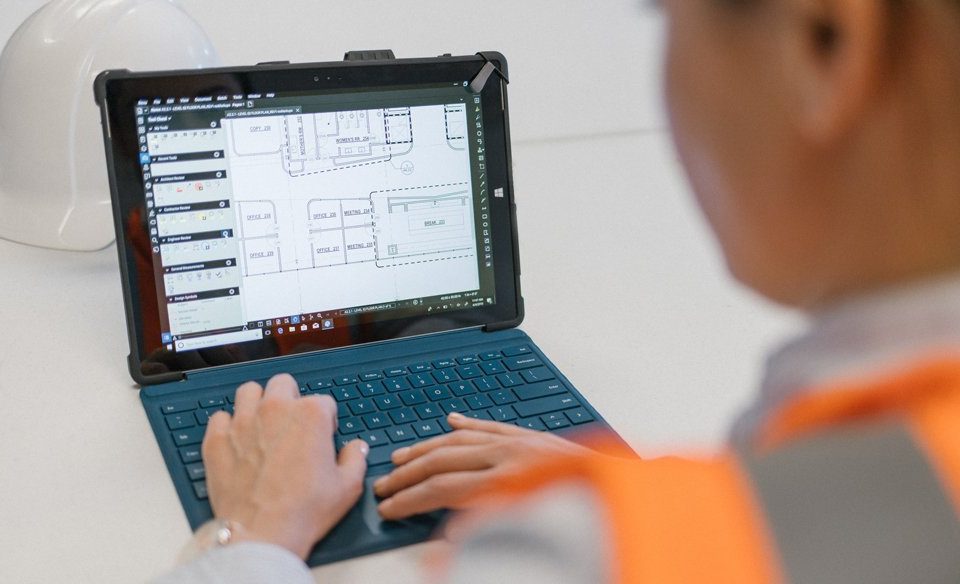 Construction worker using Bluebeam Revu