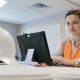 A female construction worker on a computer