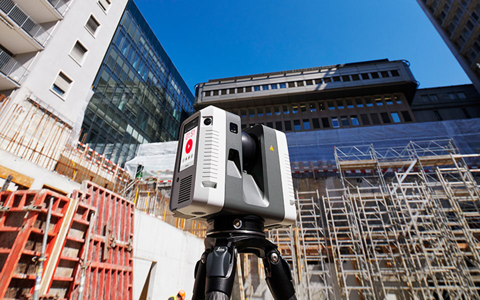 Leica RTC 360 laser scanner on a construction site.