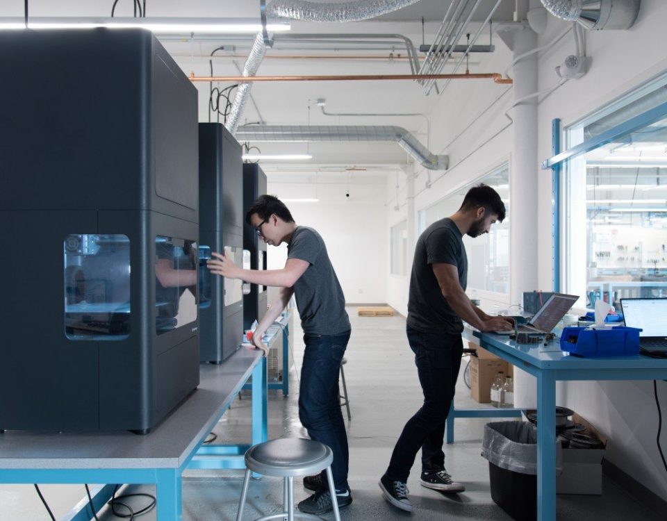 Two men working with Markforged 3D Printers